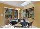 Kitchen breakfast nook with access to a private backyard patio and waterfall feature at 2218 Shadow Oaks Rd, Sarasota, FL 34240