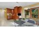 Bright dining area features custom cabinetry and a glass door opening to a tranquil outdoor space at 2218 Shadow Oaks Rd, Sarasota, FL 34240