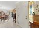 Elegant dining room featuring a chandelier, large window, and antique furniture at 2218 Shadow Oaks Rd, Sarasota, FL 34240