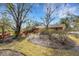 Lush front yard showcasing mature trees and landscaping enhancing the curb appeal at 2218 Shadow Oaks Rd, Sarasota, FL 34240