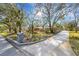 Landscaped corner lot with a long driveway leading to a spacious home at 2218 Shadow Oaks Rd, Sarasota, FL 34240