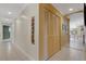 Hallway with closet and tile floors at 2218 Shadow Oaks Rd, Sarasota, FL 34240