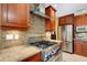 Modern kitchen features stainless steel appliances and granite countertops at 2218 Shadow Oaks Rd, Sarasota, FL 34240