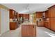 Spacious kitchen with granite countertops and wood cabinets at 2218 Shadow Oaks Rd, Sarasota, FL 34240