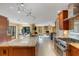Spacious kitchen boasts stone countertops, stainless steel appliances, and an open layout to the living room at 2218 Shadow Oaks Rd, Sarasota, FL 34240