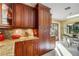 Kitchen boasts granite countertops and ample wood cabinetry at 2218 Shadow Oaks Rd, Sarasota, FL 34240