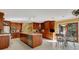 Bright kitchen with an island, stainless steel appliances, and access to a casual dining area at 2218 Shadow Oaks Rd, Sarasota, FL 34240