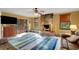 Living room with stone fireplace, hardwood floors and large windows at 2218 Shadow Oaks Rd, Sarasota, FL 34240