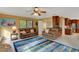 Spacious living room featuring a cozy fireplace and hardwood floors at 2218 Shadow Oaks Rd, Sarasota, FL 34240