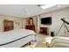 Bright bedroom boasts a skylight, ceiling fan, and a walk-in closet at 2218 Shadow Oaks Rd, Sarasota, FL 34240