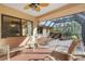 Inviting covered patio with a charming water feature and comfortable seating, perfect for outdoor relaxation at 2218 Shadow Oaks Rd, Sarasota, FL 34240