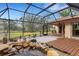 Enclosed patio showcasing a pond, brick flooring, and ample seating space at 2218 Shadow Oaks Rd, Sarasota, FL 34240