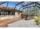 Covered patio with water feature and view of the backyard at 2218 Shadow Oaks Rd, Sarasota, FL 34240