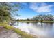 Scenic view of the lake, enhanced by the shoreline at 2218 Shadow Oaks Rd, Sarasota, FL 34240