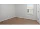 Bright bedroom with wood flooring and a window at 2551 Bartek Pl, North Port, FL 34289