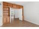 Built-in shelving and wood flooring in a bright library with French doors at 2551 Bartek Pl, North Port, FL 34289