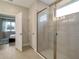 Elegant bathroom with a glass shower and modern fixtures at 2692 Mctague St, North Port, FL 34291