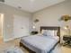 Cozy bedroom with double doors leading to another room at 2692 Mctague St, North Port, FL 34291