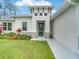 Modern front entrance with stone accents and glass door at 2692 Mctague St, North Port, FL 34291