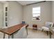 Spacious home office with wood desk and comfortable seating at 2692 Mctague St, North Port, FL 34291