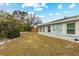 Large backyard with grassy area and mature landscaping at 2808 68Th Street W Cir, Bradenton, FL 34209