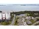 Aerial view of waterfront community with villas and high-rise building at 2906 Captains Ct, Palmetto, FL 34221