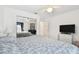 Bright bedroom with mirrored closet doors and TV at 2906 Captains Ct, Palmetto, FL 34221