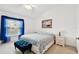 Bedroom with blue curtains and ottoman at 2906 Captains Ct, Palmetto, FL 34221