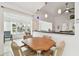 Casual dining area with table and chairs, looking toward kitchen at 2906 Captains Ct, Palmetto, FL 34221