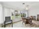 Sunlit dining area with table and chairs and view to the outside at 2906 Captains Ct, Palmetto, FL 34221