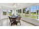 Sun-filled dining area with table and chairs, and view of backyard at 2906 Captains Ct, Palmetto, FL 34221