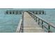 Wooden pier with T-shaped end over calm water at 2906 Captains Ct, Palmetto, FL 34221