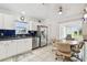 Fully equipped kitchen with stainless steel appliances and a dining area at 2906 Captains Ct, Palmetto, FL 34221