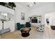 Bright living room featuring ample seating, a built-in entertainment center, and decorative accents at 2906 Captains Ct, Palmetto, FL 34221
