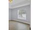 Spacious bedroom with hardwood floors and large window at 328 San Marino Ave, North Port, FL 34287