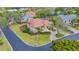 Bird's-eye view of a home with a red tile roof and lush landscaping at 3318 Bayou Sound, Longboat Key, FL 34228