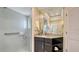 Clean bathroom with a glass shower, granite vanity, and a built-in shelf at 3318 Bayou Sound, Longboat Key, FL 34228