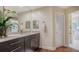 Bathroom with granite vanity, modern fixtures, and a linen closet at 3318 Bayou Sound, Longboat Key, FL 34228