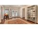 Elegant entryway with hardwood floors, a statement rug, and glass doors at 3318 Bayou Sound, Longboat Key, FL 34228