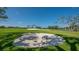 Picturesque golf course with lush greens, sand traps, and mature trees at 3318 Bayou Sound, Longboat Key, FL 34228