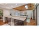 Kitchen features granite counters, stainless steel appliances, and a breakfast bar at 3318 Bayou Sound, Longboat Key, FL 34228
