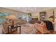 Living room features hardwood floors, comfortable seating and built-in shelving at 3318 Bayou Sound, Longboat Key, FL 34228