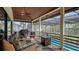 Spacious screened patio overlooking the pool, with wicker furniture at 3318 Bayou Sound, Longboat Key, FL 34228