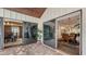 Covered patio with sliding doors leading to the dining room at 3318 Bayou Sound, Longboat Key, FL 34228