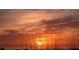 Stunning sunset over the ocean with tall grasses in the foreground at 3318 Bayou Sound, Longboat Key, FL 34228