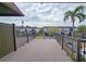 Deck with view of neighboring buildings and palm tree at 3333 Ramblewood Ct, Sarasota, FL 34237