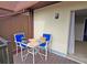 Private balcony with table and chairs, ideal for relaxing at 3333 Ramblewood Ct, Sarasota, FL 34237