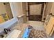 Well-appointed bathroom with granite vanity and decorative tile at 3333 Ramblewood Ct, Sarasota, FL 34237