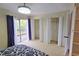 Spacious bedroom with private balcony access and ample closet space at 3333 Ramblewood Ct, Sarasota, FL 34237
