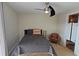 Charming bedroom with a ceiling fan and en-suite bathroom at 3333 Ramblewood Ct, Sarasota, FL 34237